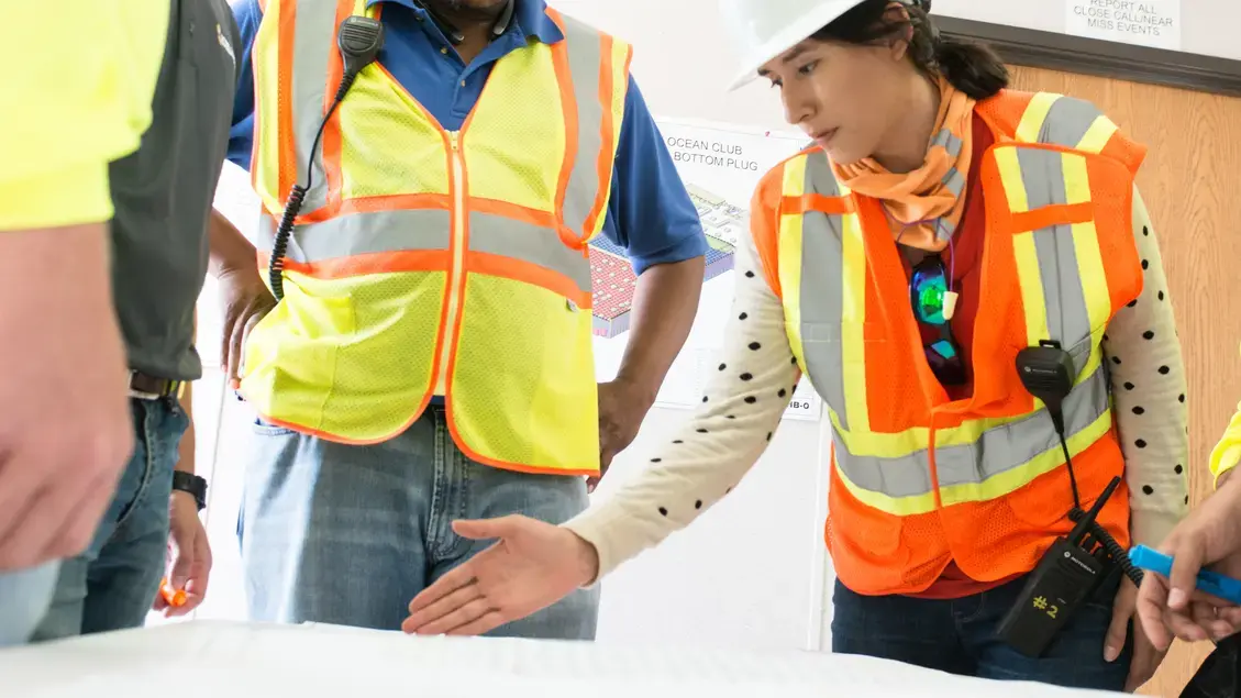 Employees discussing Ritz Carlson project